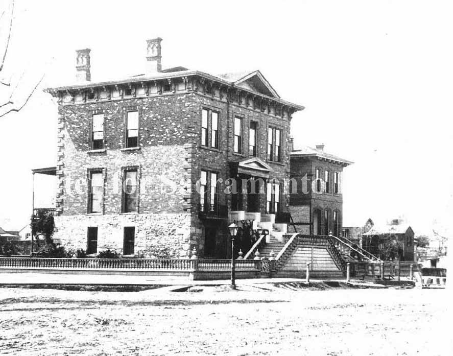 A large brick building at the Stanford Mansion at 8th and N streets, 1890