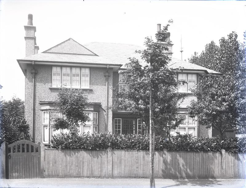 The name of this house is written on the gate. It seems to read as "Lyndhurst", Sutton, 1911