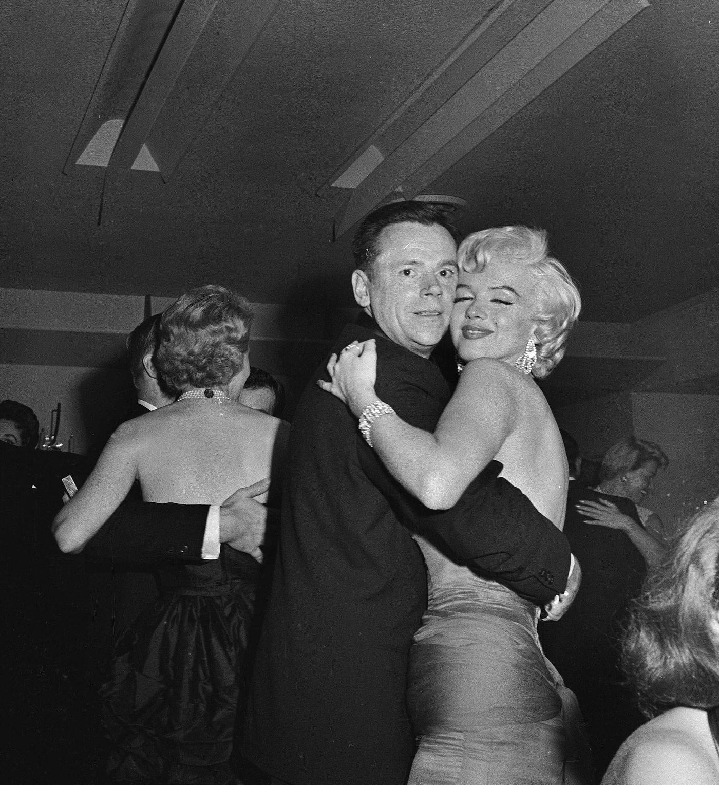 Marilyn Monroe dances with co-star Tom Ewell at the wrap party for the filming of "The Seven Year Itch" at Romanoff's Restaurant in 1954