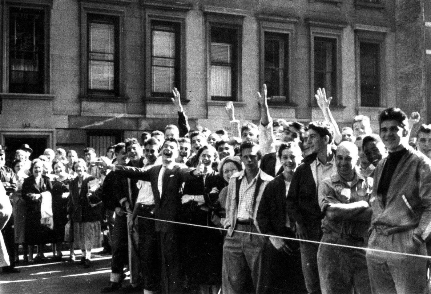 A crowd of fans waves to Marilyn Monroe in 1954 during the filming of "The Seven Year Itch" in New York