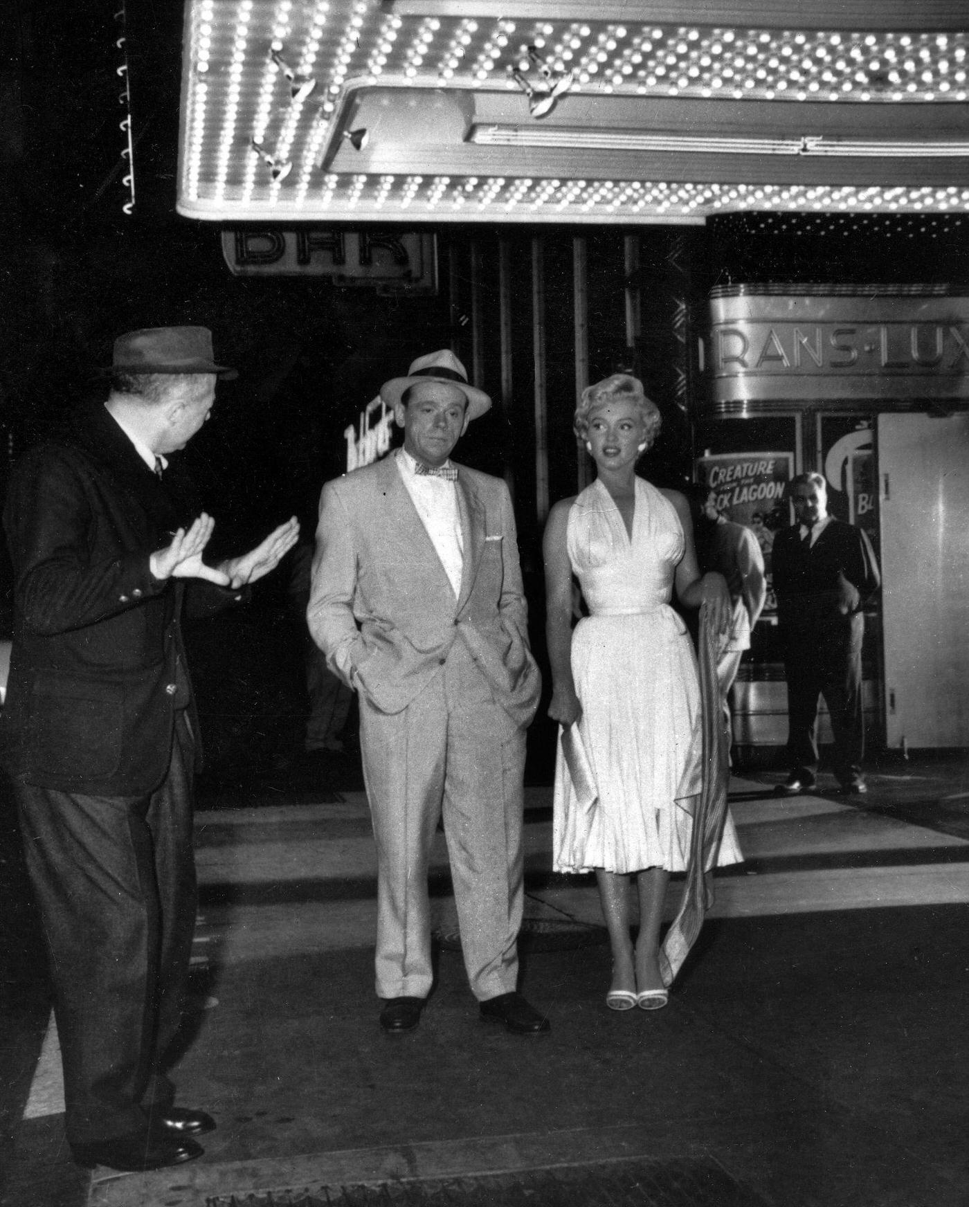 Marilyn Monroe with co-star Tom Ewell and director Billy Wilder on the corner of 51st Street and Lexington Avenue while filming the famous skirt-blowing scene for "The Seven Year Itch" in September, 1954