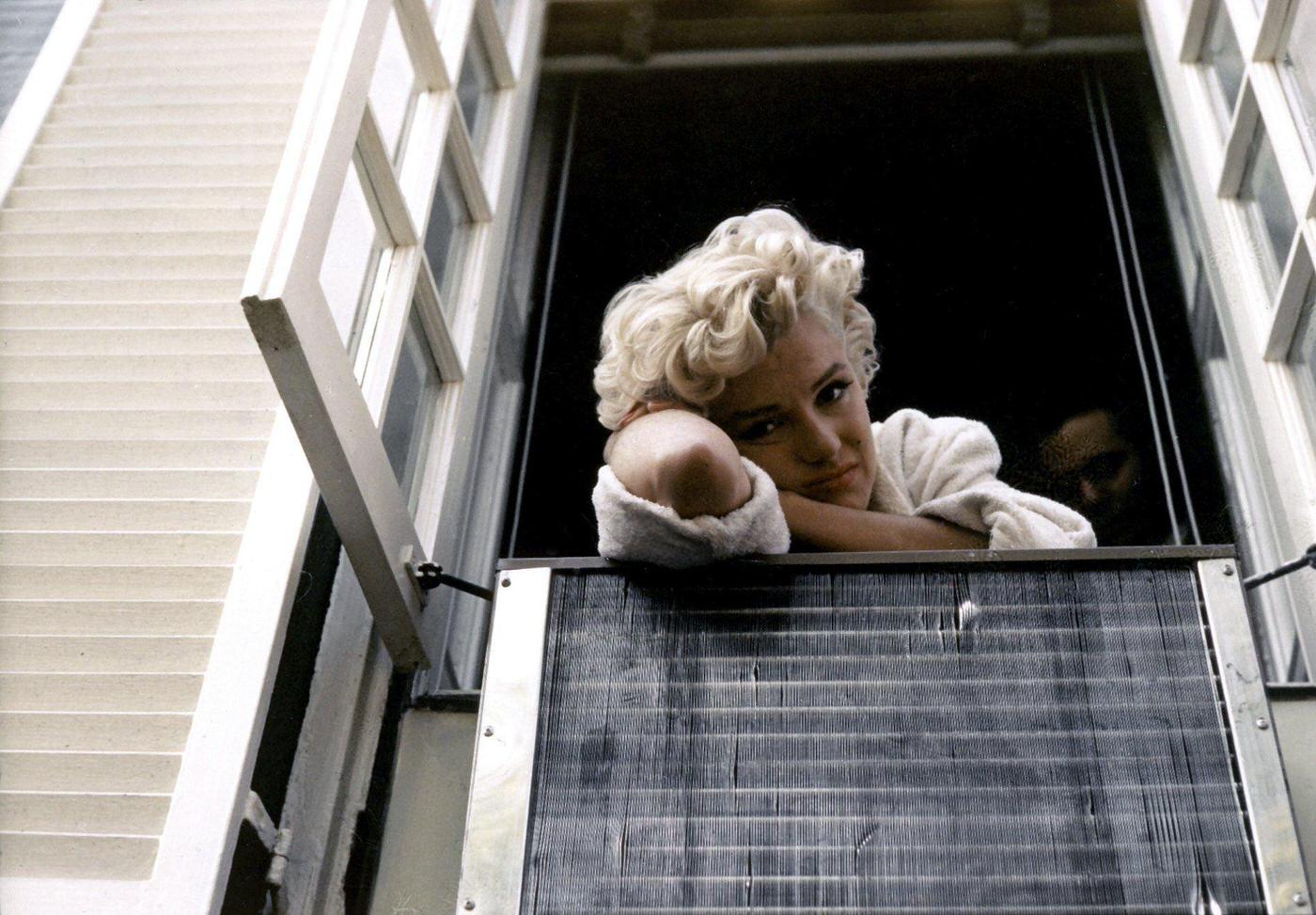 Marilyn Monroe goes over lines with her costar in The Seven Year Itch, Tom Ewell.