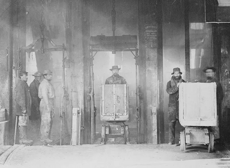 Mine workers are pictured coming out of a mine shaft in Virginia City, Nevada, during the years 1867-1888.