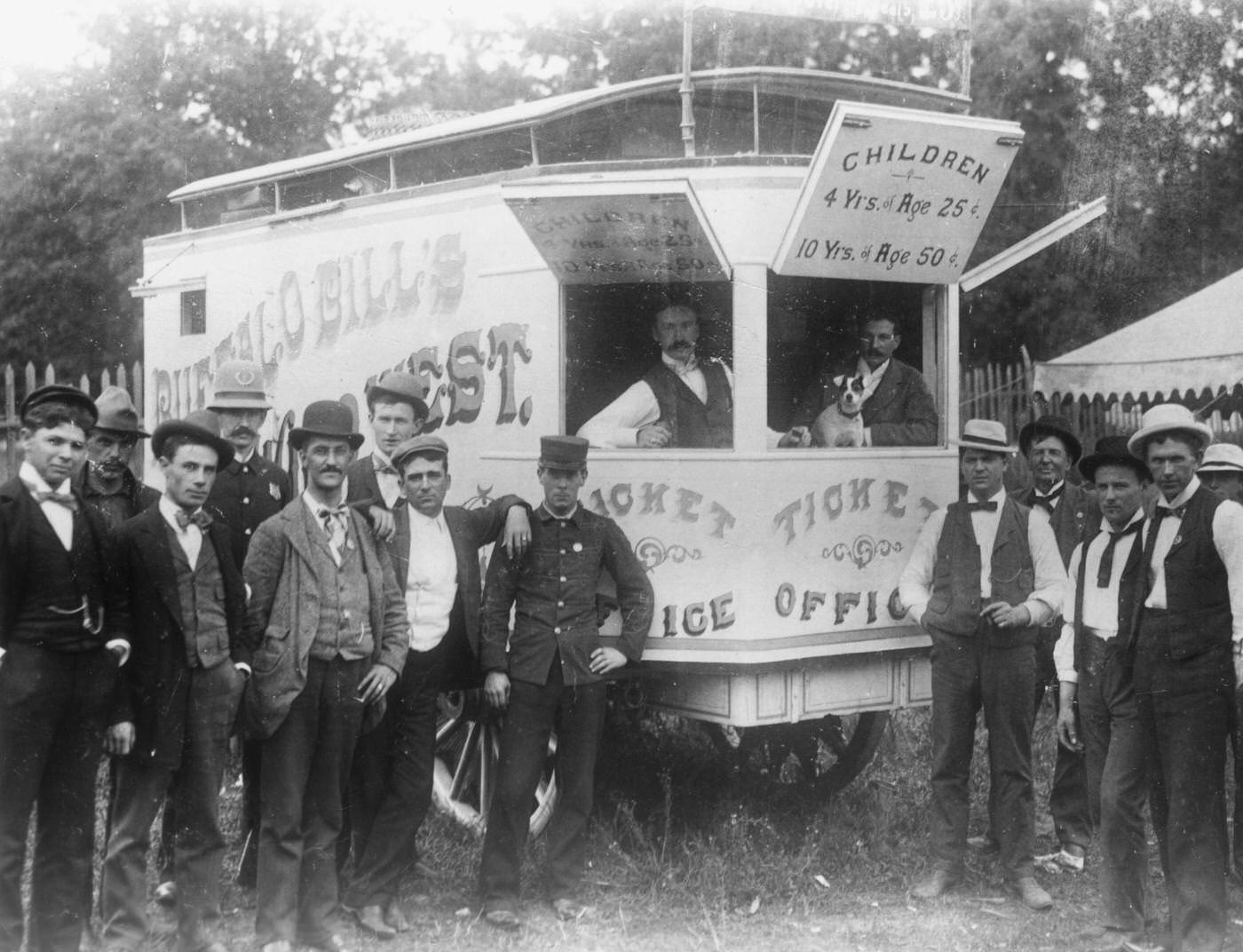Selling the Wild West, circa 1890: Male employees gathered around a wagon that serves as the ticket office for the Buffalo Bill's Wild West show.