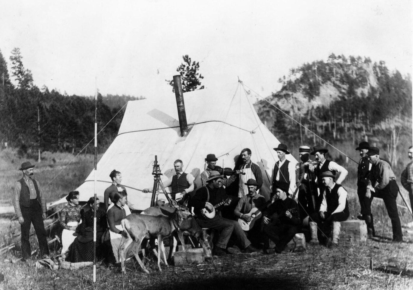 Railroad Camp, United States: Railroad workers entertain visitors during happy hour at a railroad camp alongside a construction route in South Dakota.