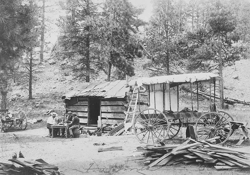 A poker party is underway at John Doyle’s ranch in Arizona, between 1887 and 1889.