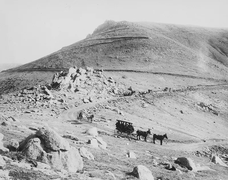 Buckboard and coaches zigzagging down the “W” Pike’s Peak carriage road in Colorado in 1911.