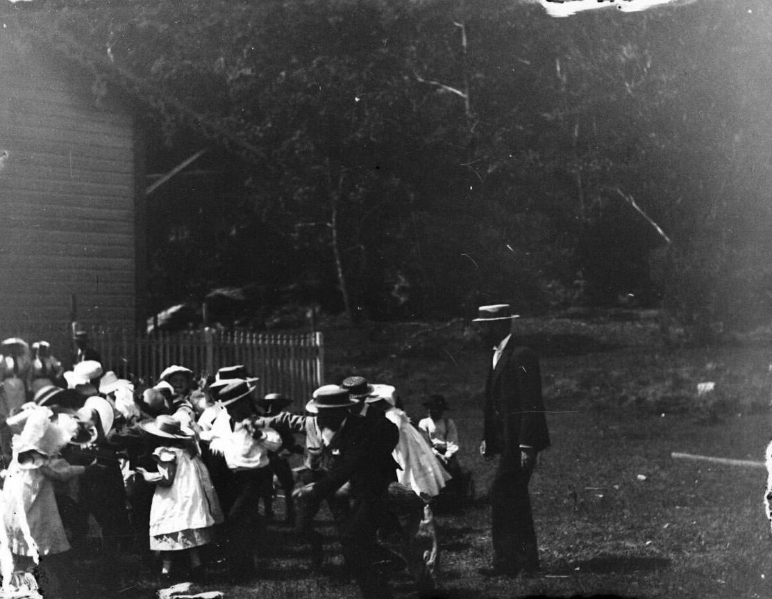 Children playing in Victorian era clothing