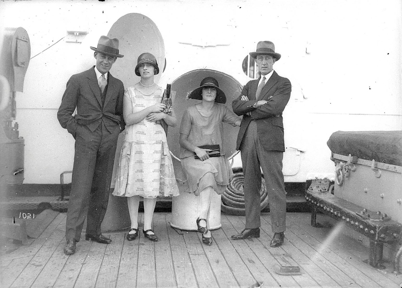 Portrait of four men and women aboard a ship on Sydney Harbour