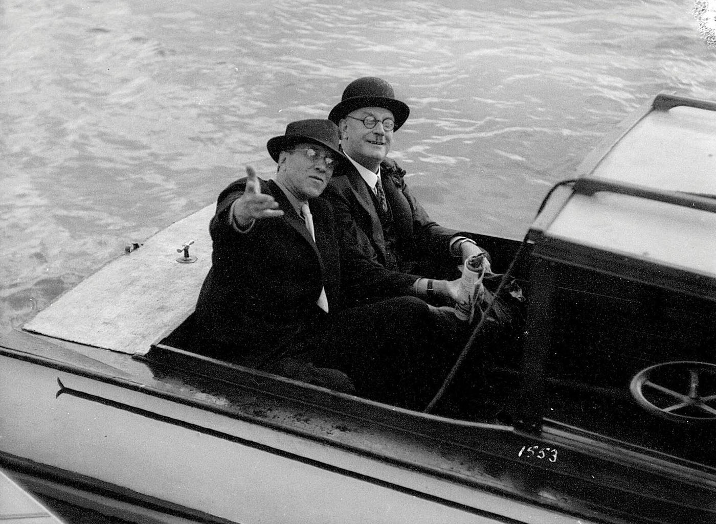 Two men seated in a motor launch, MISS PHYLISS, on Sydney Harbour