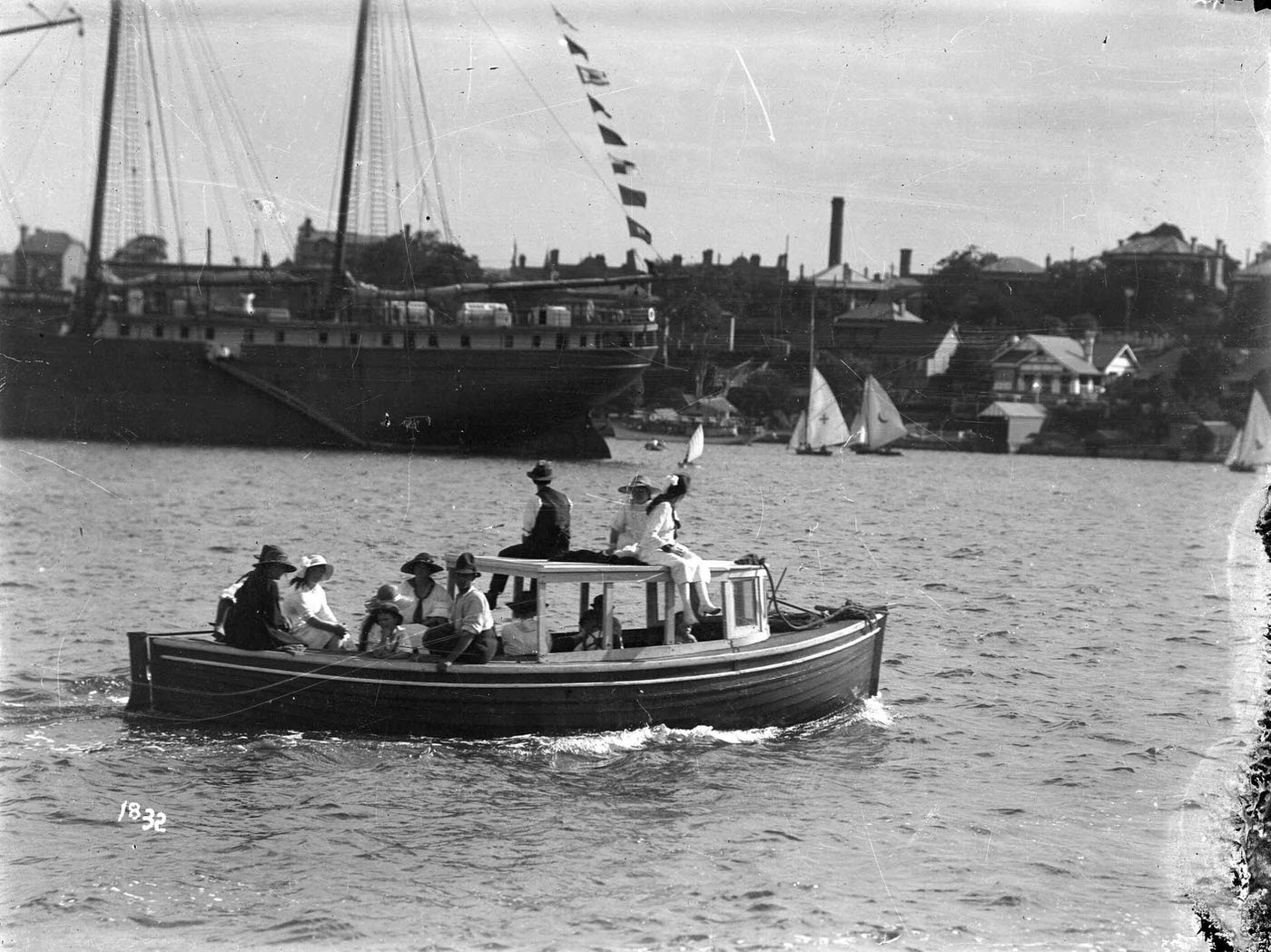 Motor launch carrying a group of spectators on Sydney Harbour