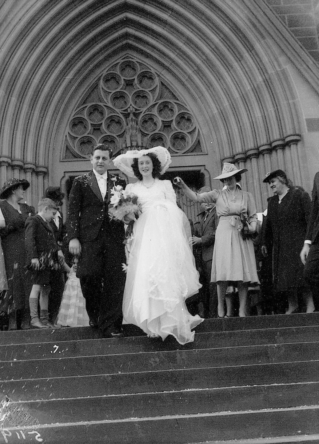 Bride and groom walking down St Marys Cathedral steps, Sydney