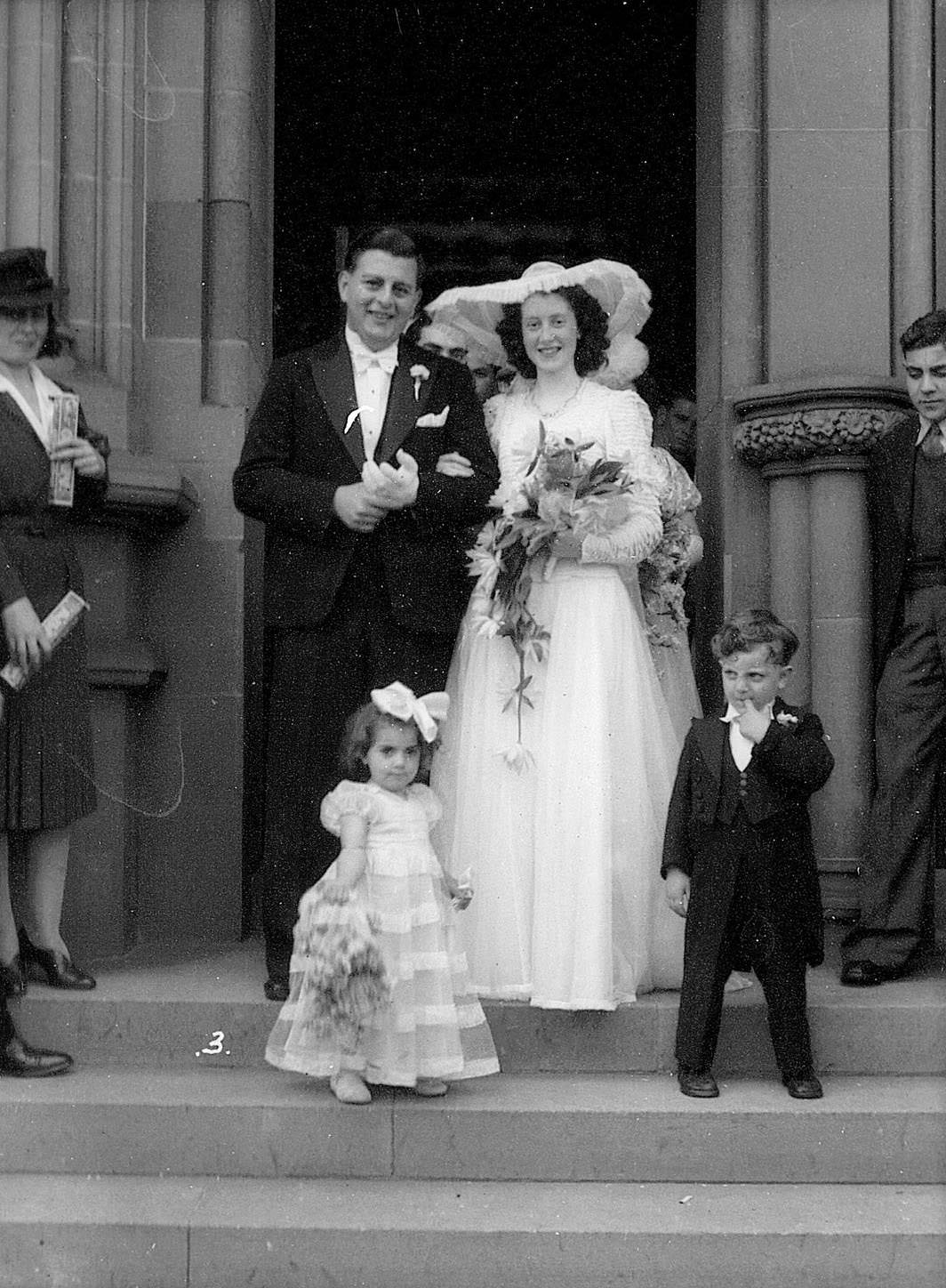 Bride and groom leaving St Marys Cathedral, Sydney