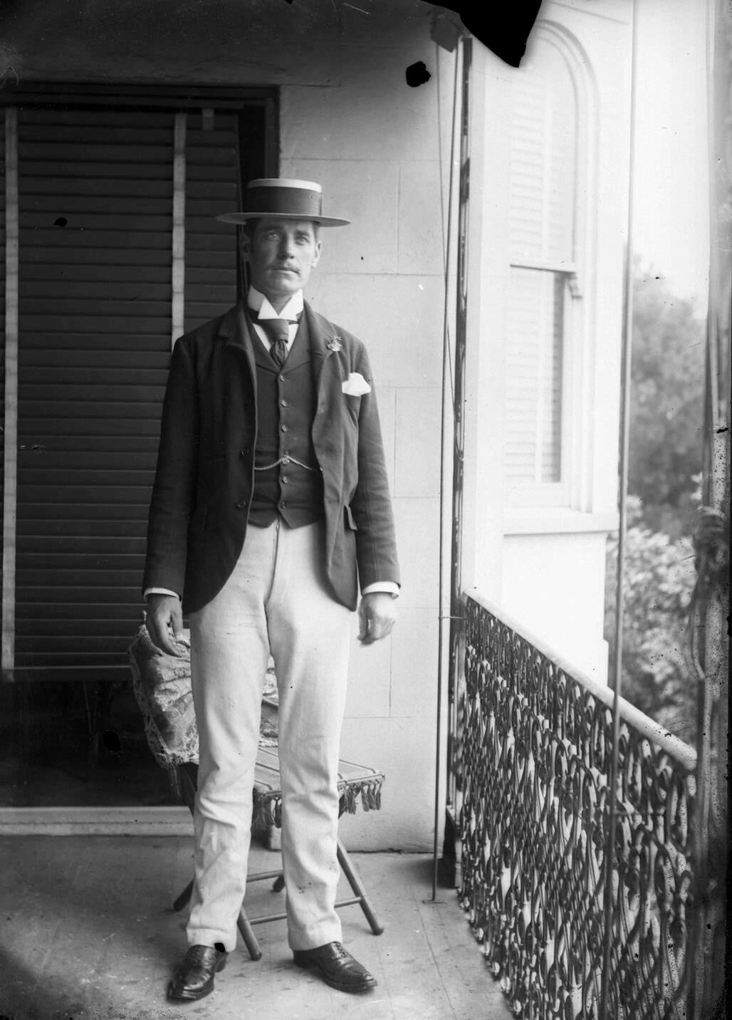 Portrait of a man standing on a verandah