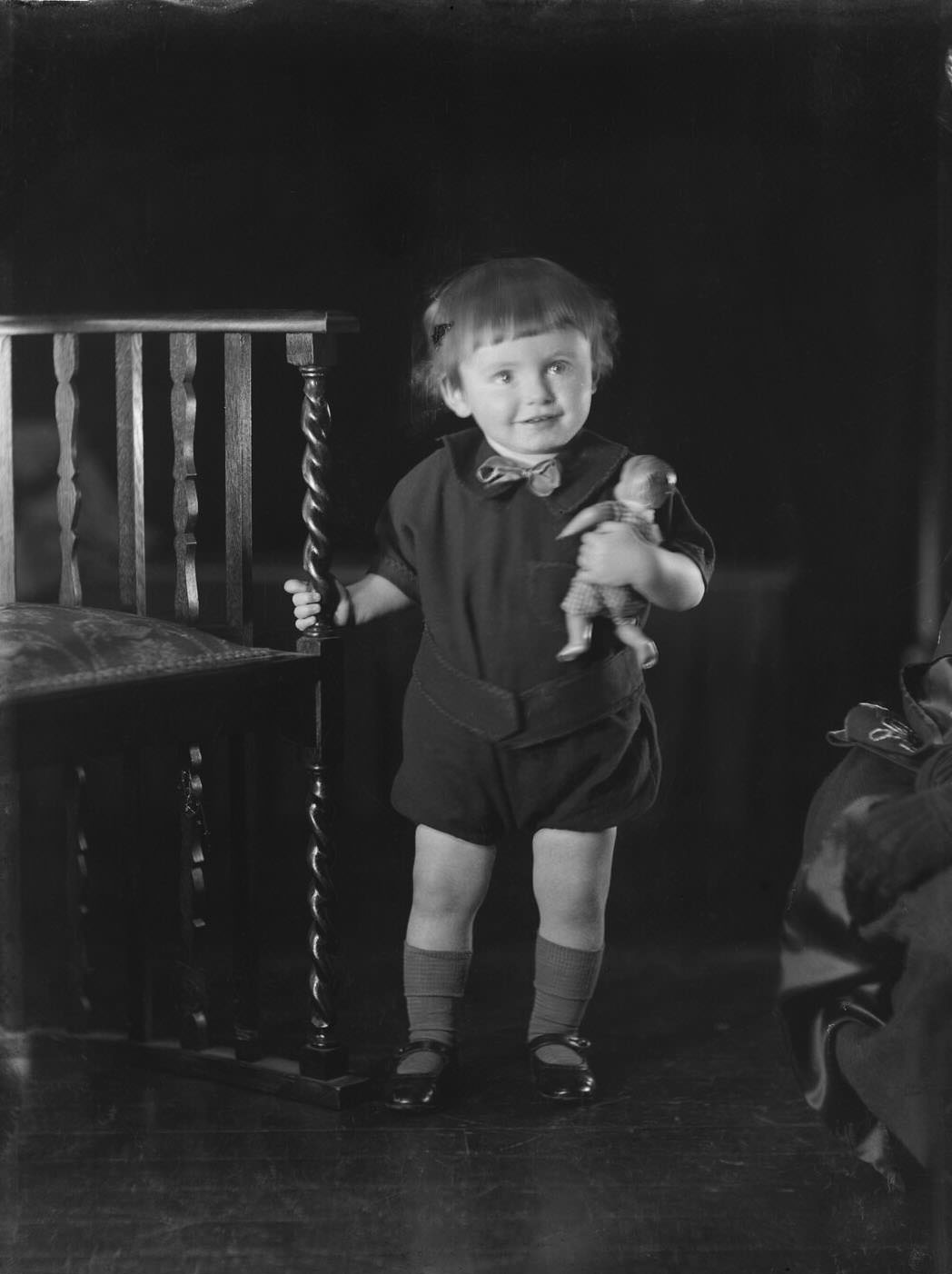 Portrait of a young child with a doll