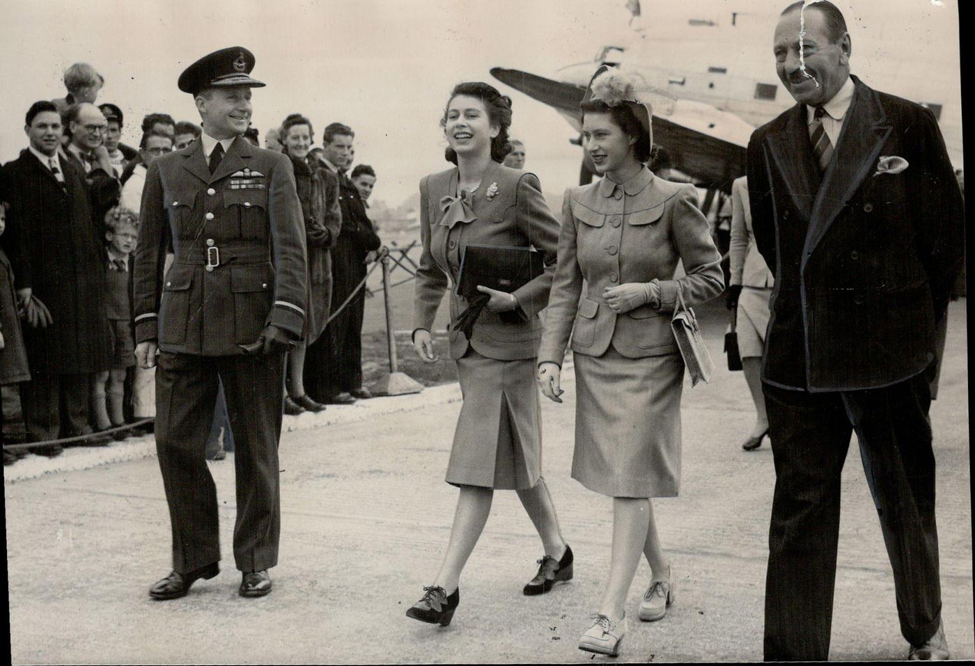 Princess Margaret is met by her betrothed sister, Princess Elizabeth, at London airport after the former had flown back from Northern Ireland launching of the new liner Edinburgh Castle, Canada, October 24, 1947.