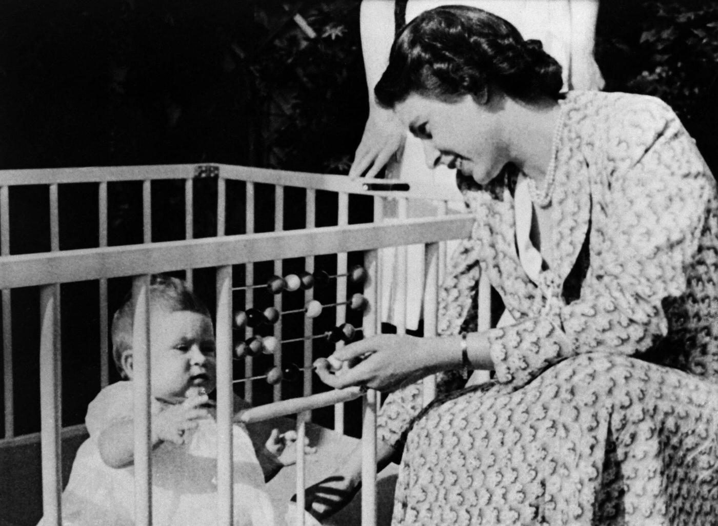 Future Queen Elizabeth II of England with her baby Prince Charles, 1949.