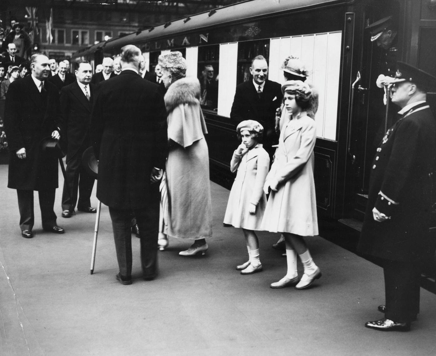 Princesses Elizabeth and Margaret see off their parents, King George VI and Queen consort Elizabeth, at Waterloo Station, London, May 6th, 1939.