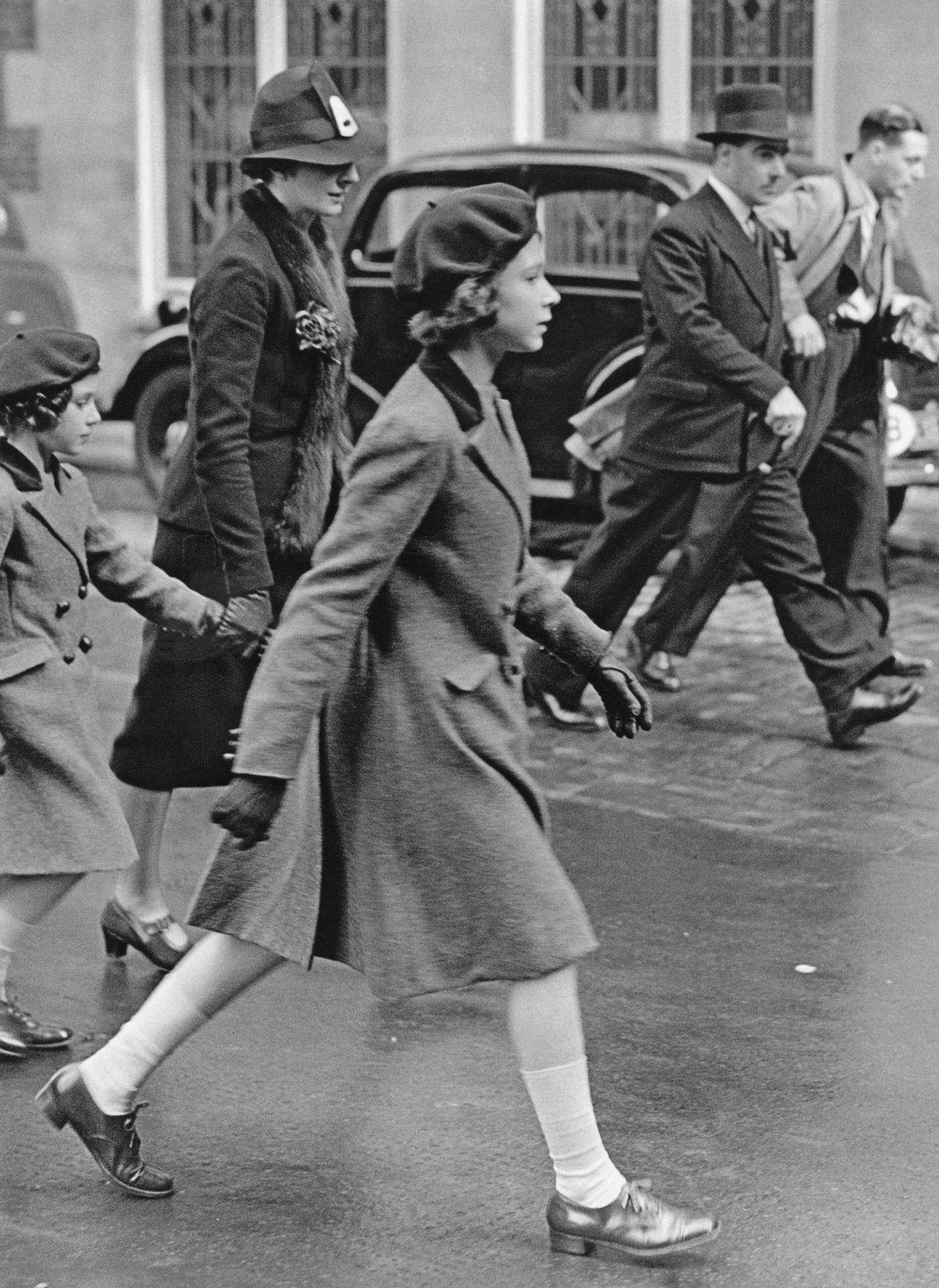 Princesses visit YWCA: Royal governess Marion Crawford accompanies Princesses Elizabeth and Margaret to the headquarters of the YWCA (Young Women's Christian Association) off Tottenham Court Road, London, 15th May 1939.