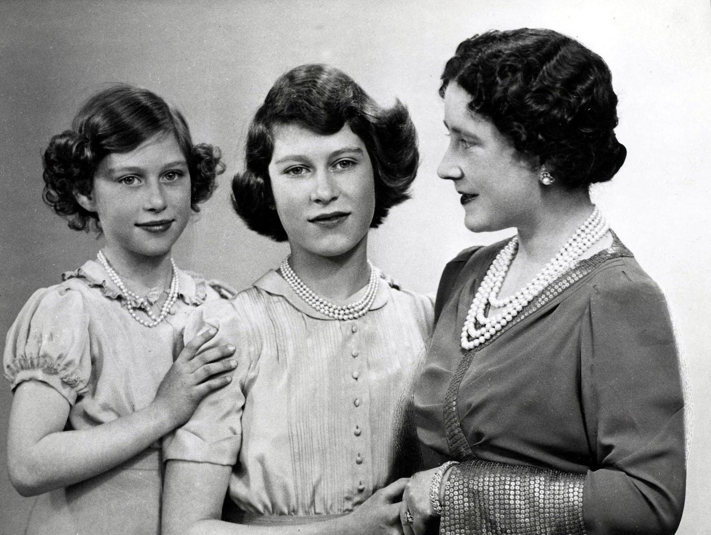 Queen Elizabeth The Queen Mother with her two daughters, Princess Margaret (left) and Princess Elizabeth (later Queen Elizabeth II) during World War Two, 1940.