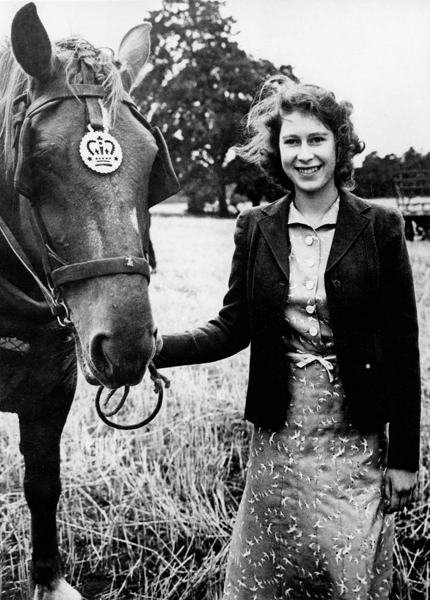 Princess Elizabeth (the future Queen Elizabeth II) at Sandringham with one of the horses, undated.