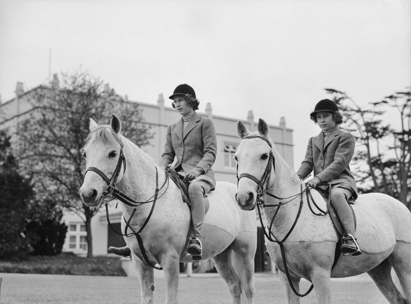 The Royal Princesses Elizabeth and Margaret riding horses, UK, 1940.