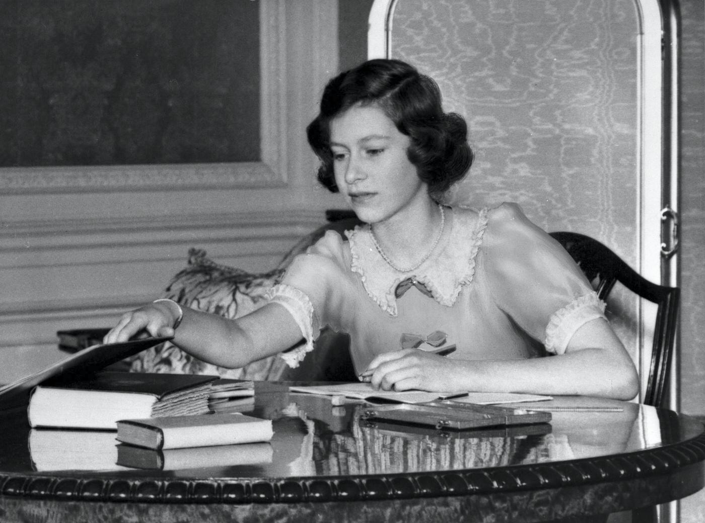 Princess Elizabeth with a book at Windsor Castle, Berkshire, Great Britain, 22nd June 1940.