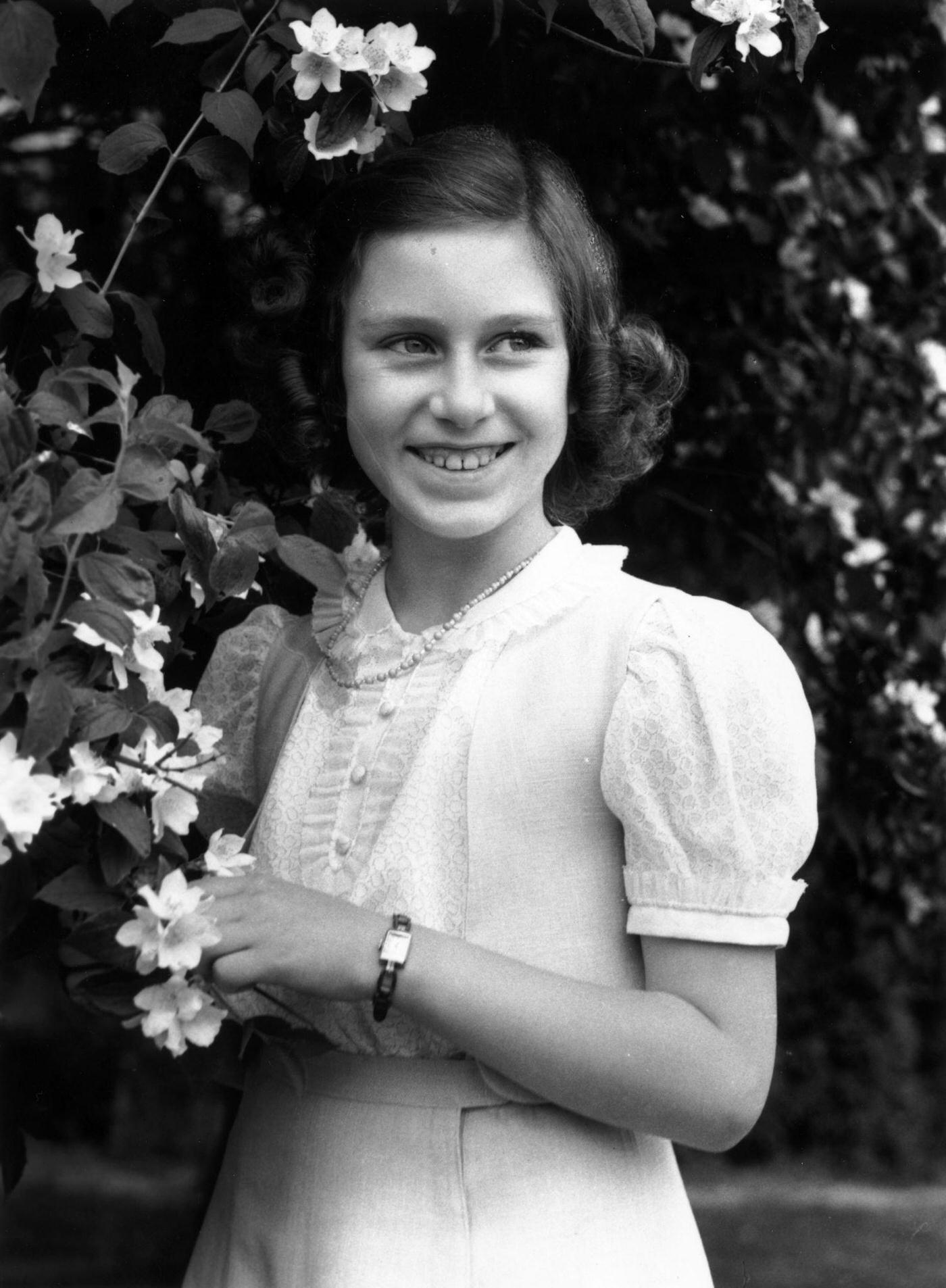 Princess Margaret Rose, younger daughter of King George VI and Queen Elizabeth and sister of Queen Elizabeth II, in the garden at Windsor Castle, 1941