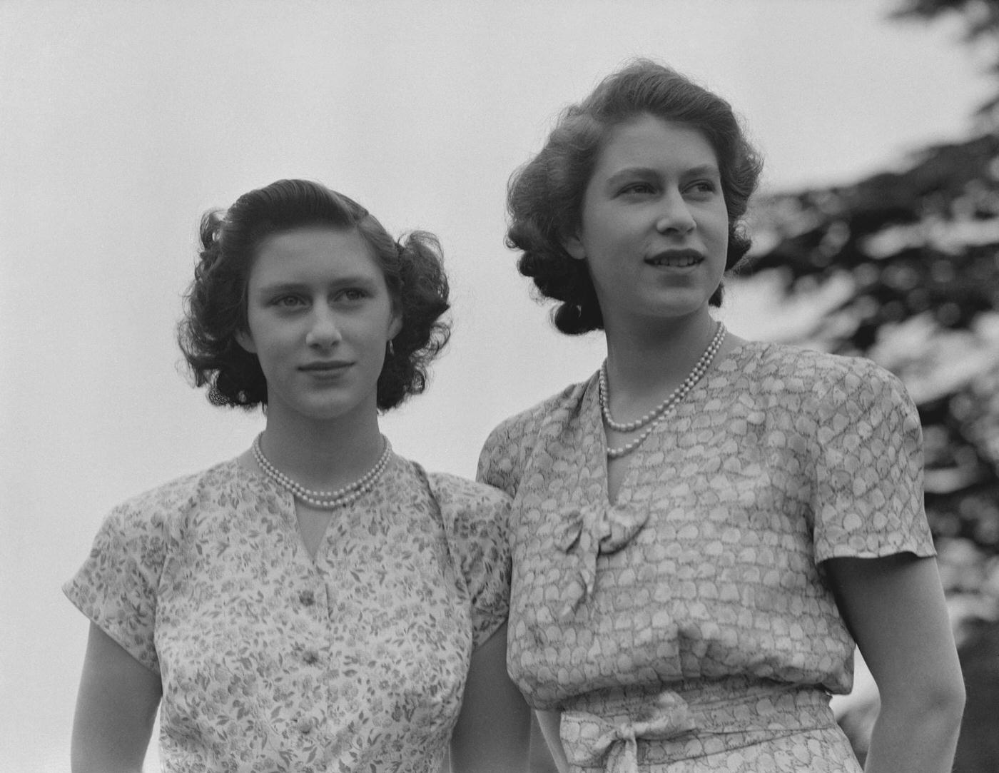 Queen Elizabeth II and Princess Margaret wearing summer dresses, 1942.