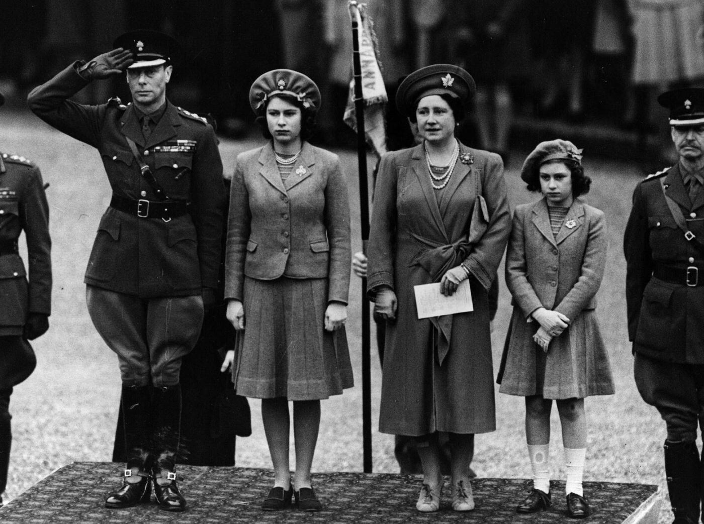Queen Elizabeth, Princess Elizabeth and Princess Margaret inspecting the Grenadier Guards (who are not visible) on Princess Elizabeth's 16th birthday.