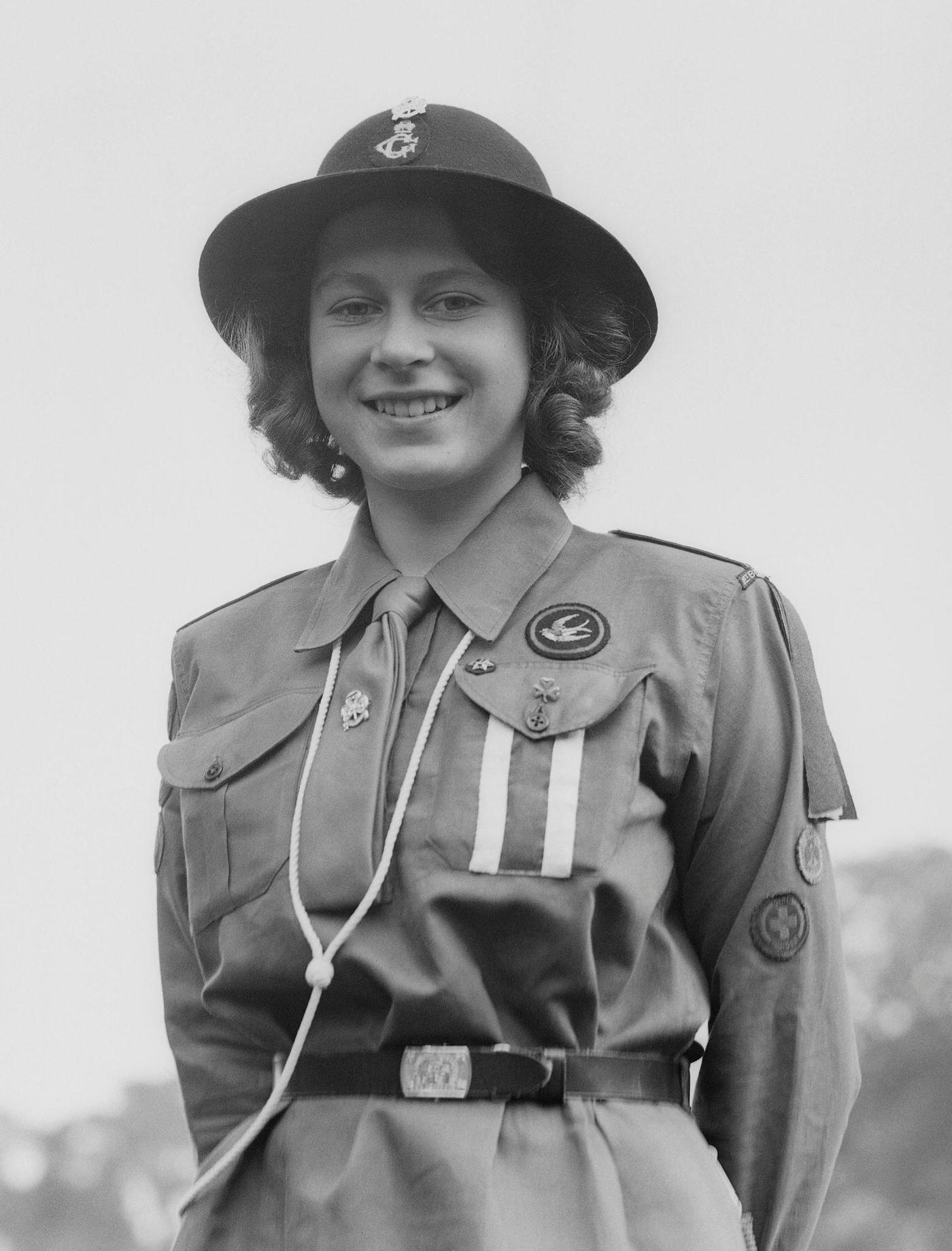 Princess Elizabeth poses in her girl guide uniform in Frogmore, Windsor, England on April 11, 1942.