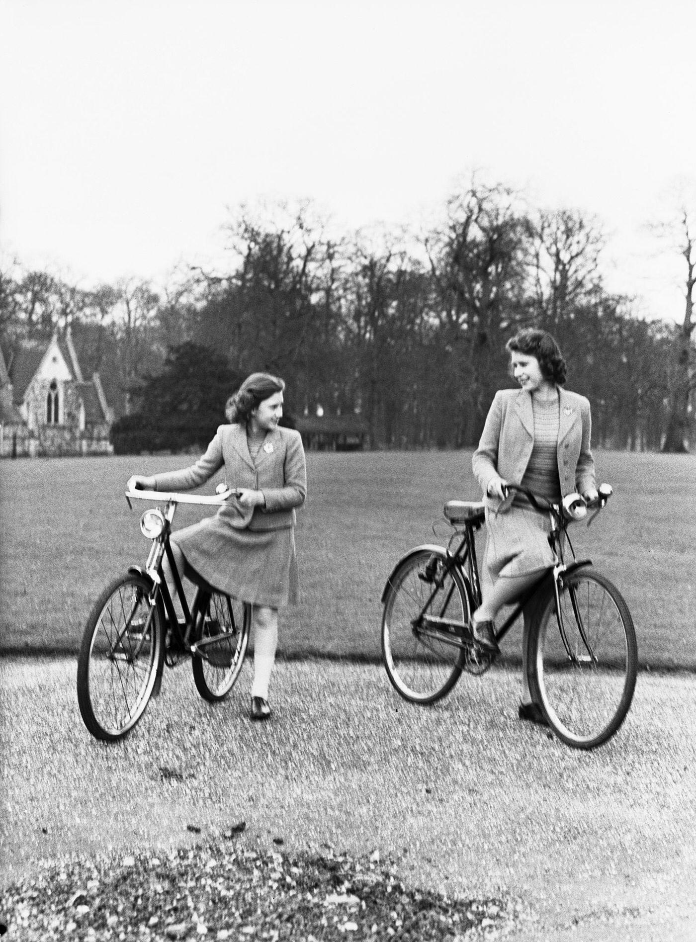 Princess Elizabeth and Princess Margaret on bicycles at the Royal Lodge, Windsor, 1942