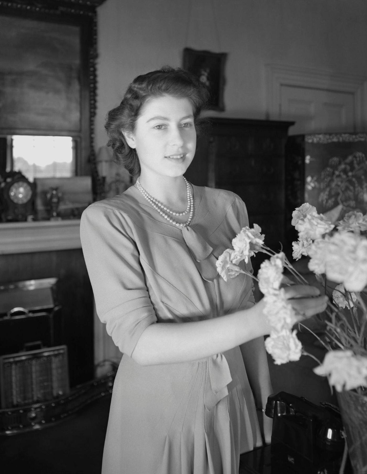 Princess Elizabeth (Queen Elizabeth II) arranging flowers at Windsor Castle, Great Britain, 8 July 1946.