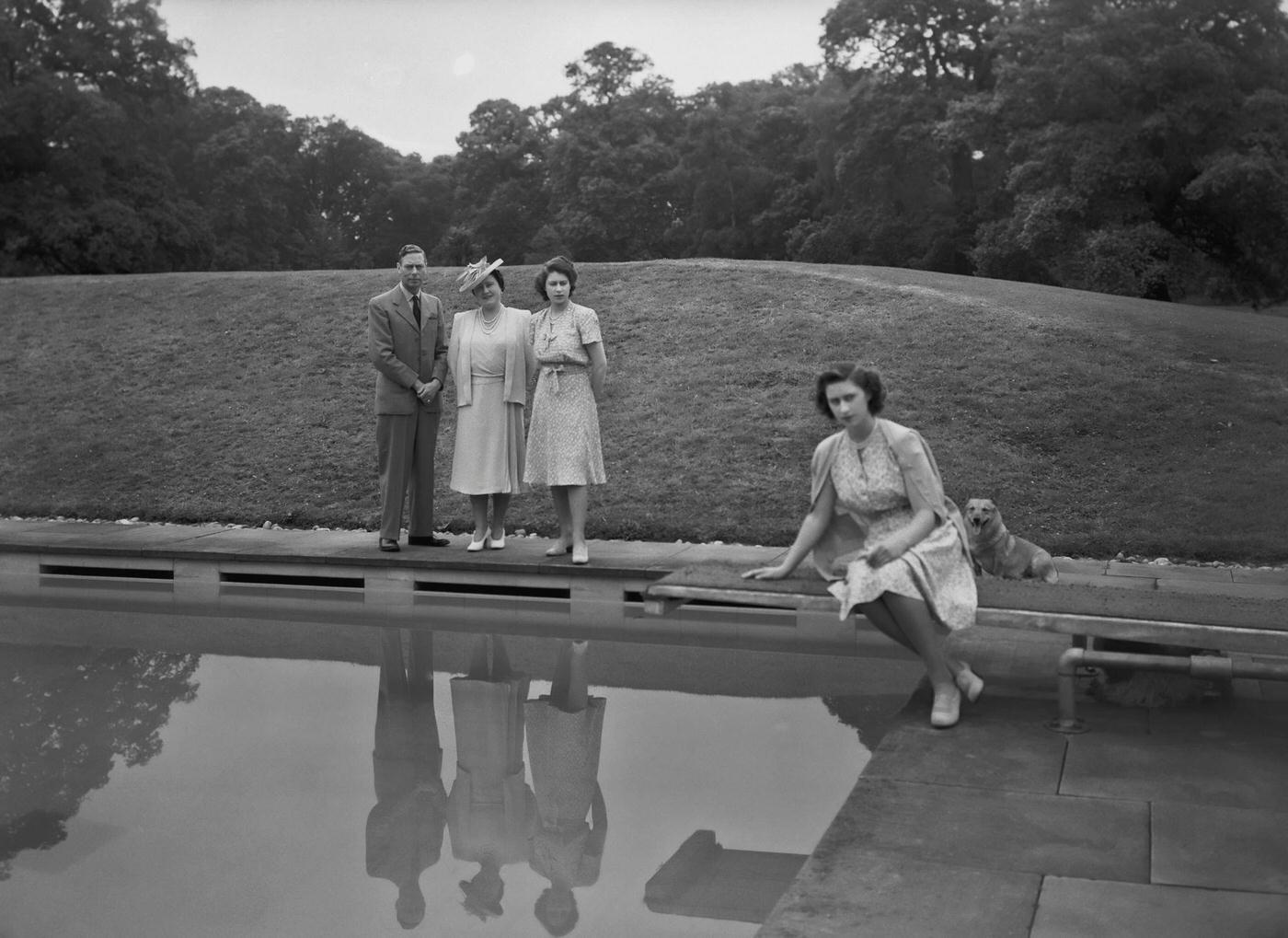 King George VI, Queen Elizabeth, Princess Elizabeth, and Princess Margaret at Windsor Castle, England, 8 July 1946.