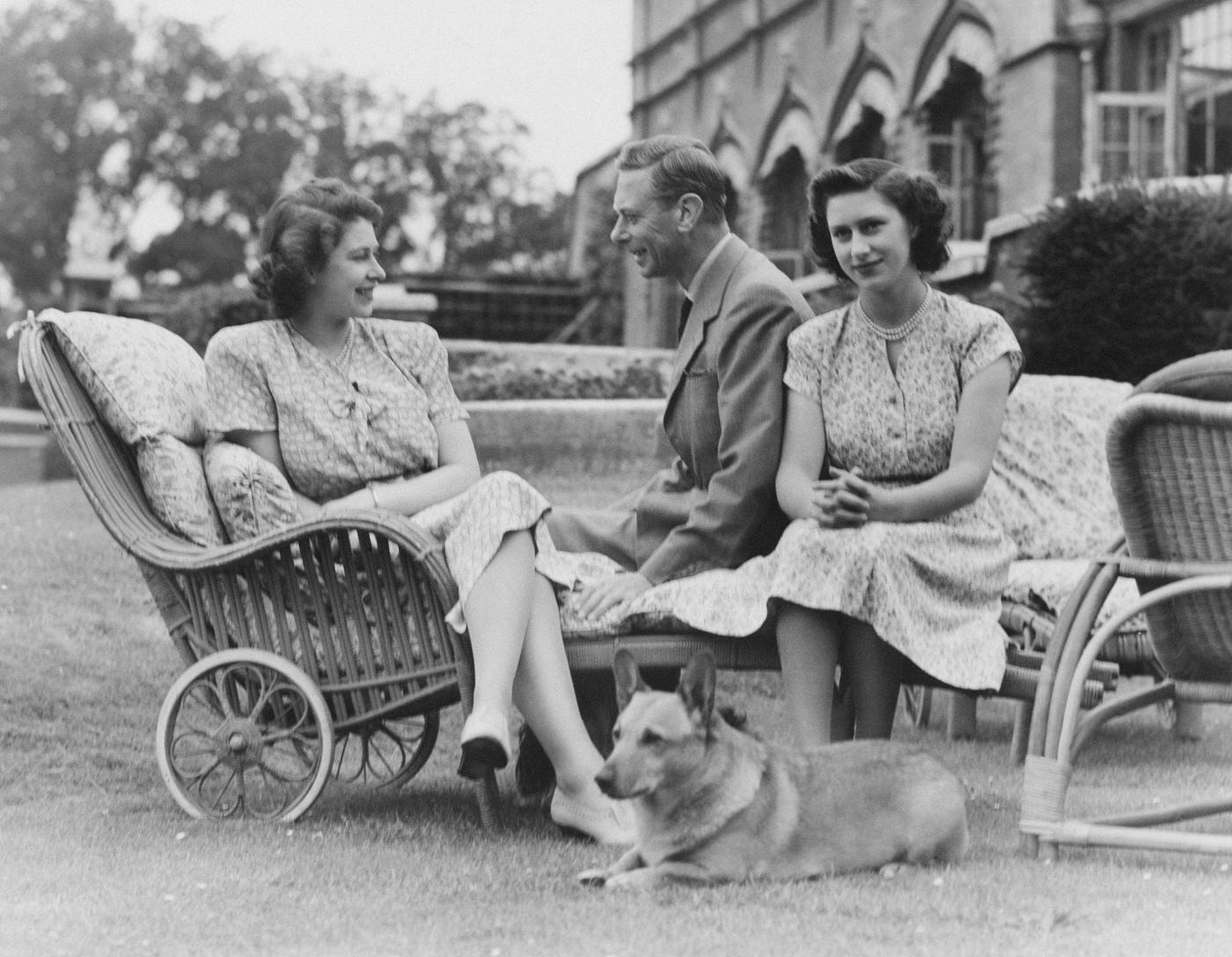 King George VI with Princess Elizabeth and Princess Margaret at the Royal Lodge, Windsor, England, 8 July 1946.