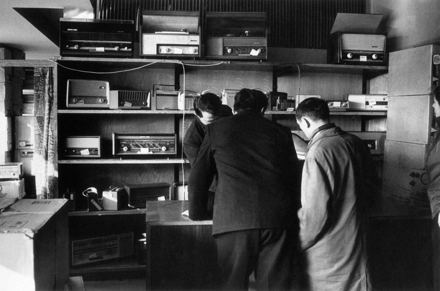 Men buying radios in a shop on Marsala Tita Street, 1965