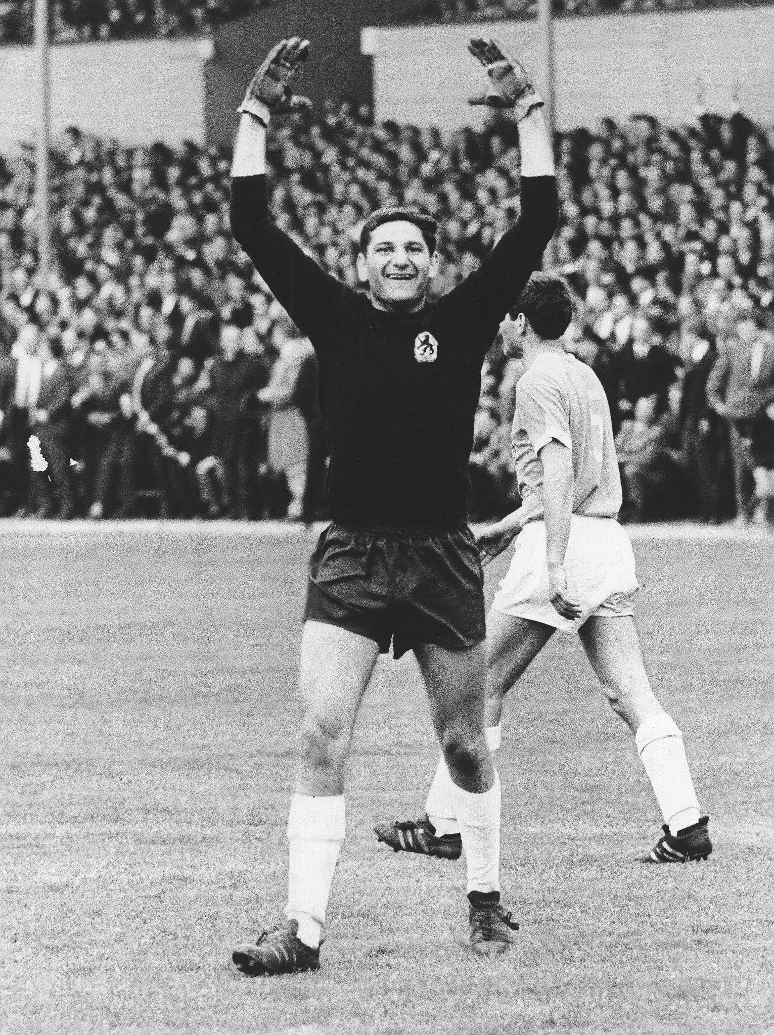 Petar Radenkovic, goalkeeper for TSV 1860 Munich, raising his arms in a game against Borussia Dortmund on May 21, 1966.