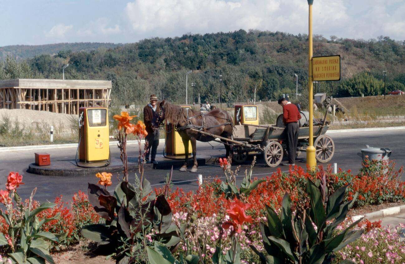 A horse and cart stopped at a garage to fill up with petrol or gas! This amusing scene is located in the former Yugoslavia in 1967.