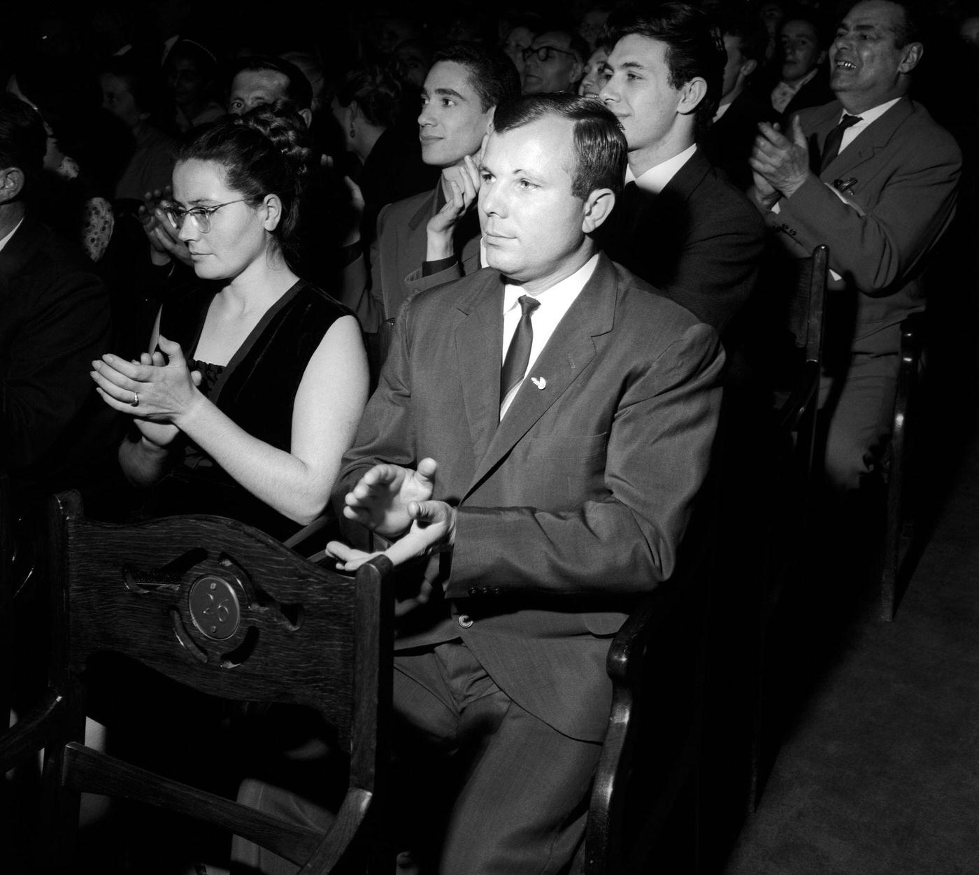 Yuri Gagarin and his wife Valentina Goryacheva applauding the Company of the Teatro alla Scala after their performance of 'Turandot' at the Bolshoi Theatre in Moscow, 1964