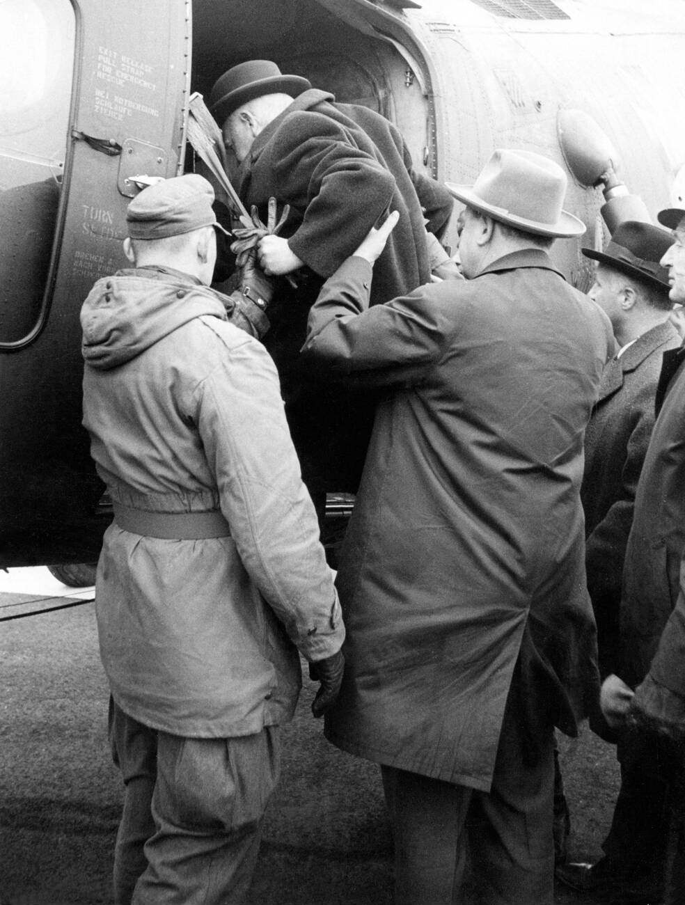 Men evacuate during the North Sea Flood