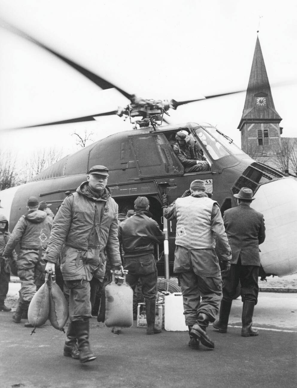 Unloading a helicopter during the North Sea Flood of 1962 in Hamburg, West Germany