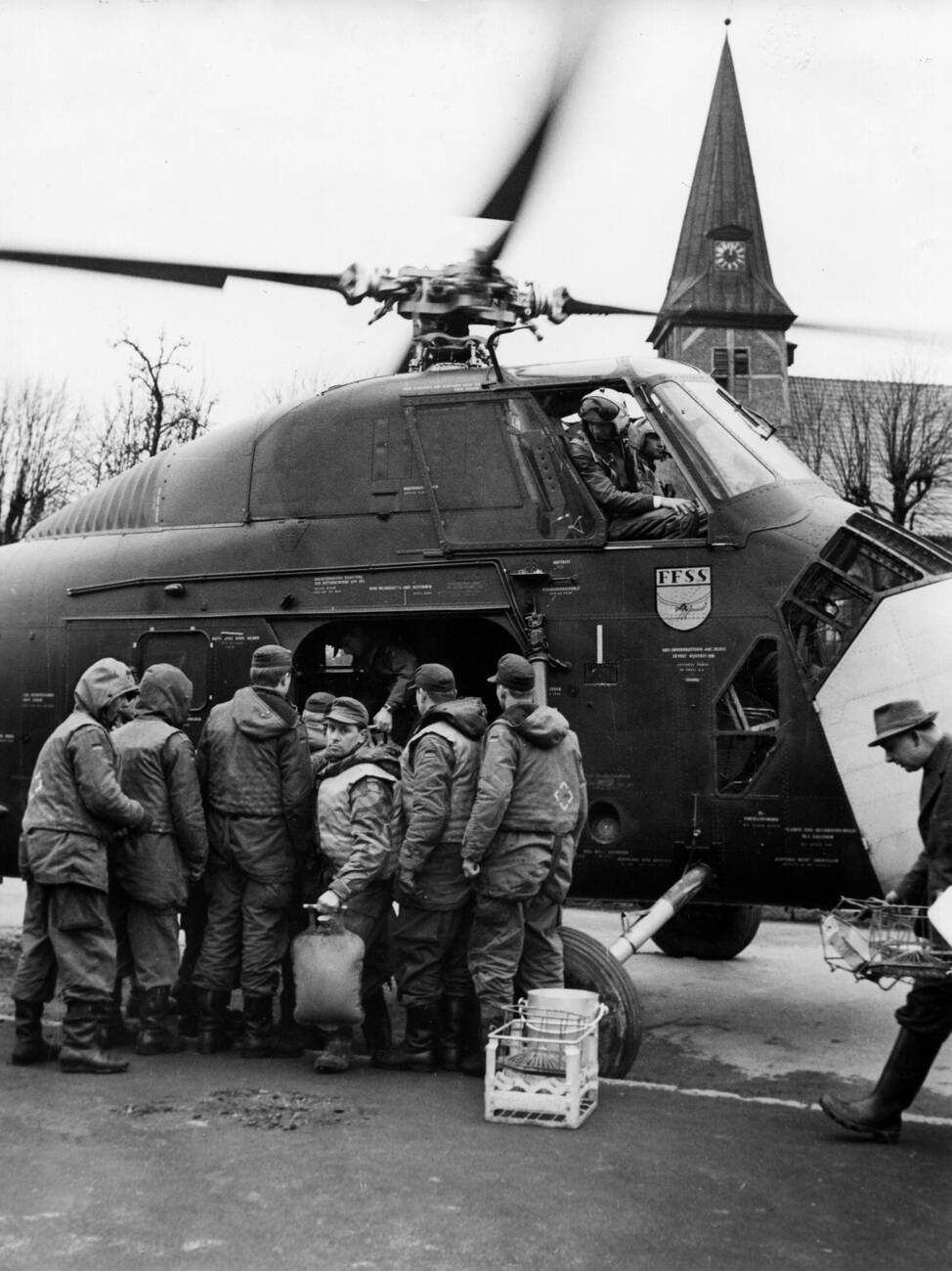 Unloading a helicopter during the North Sea Flood of 1962 in Hamburg, West Germany