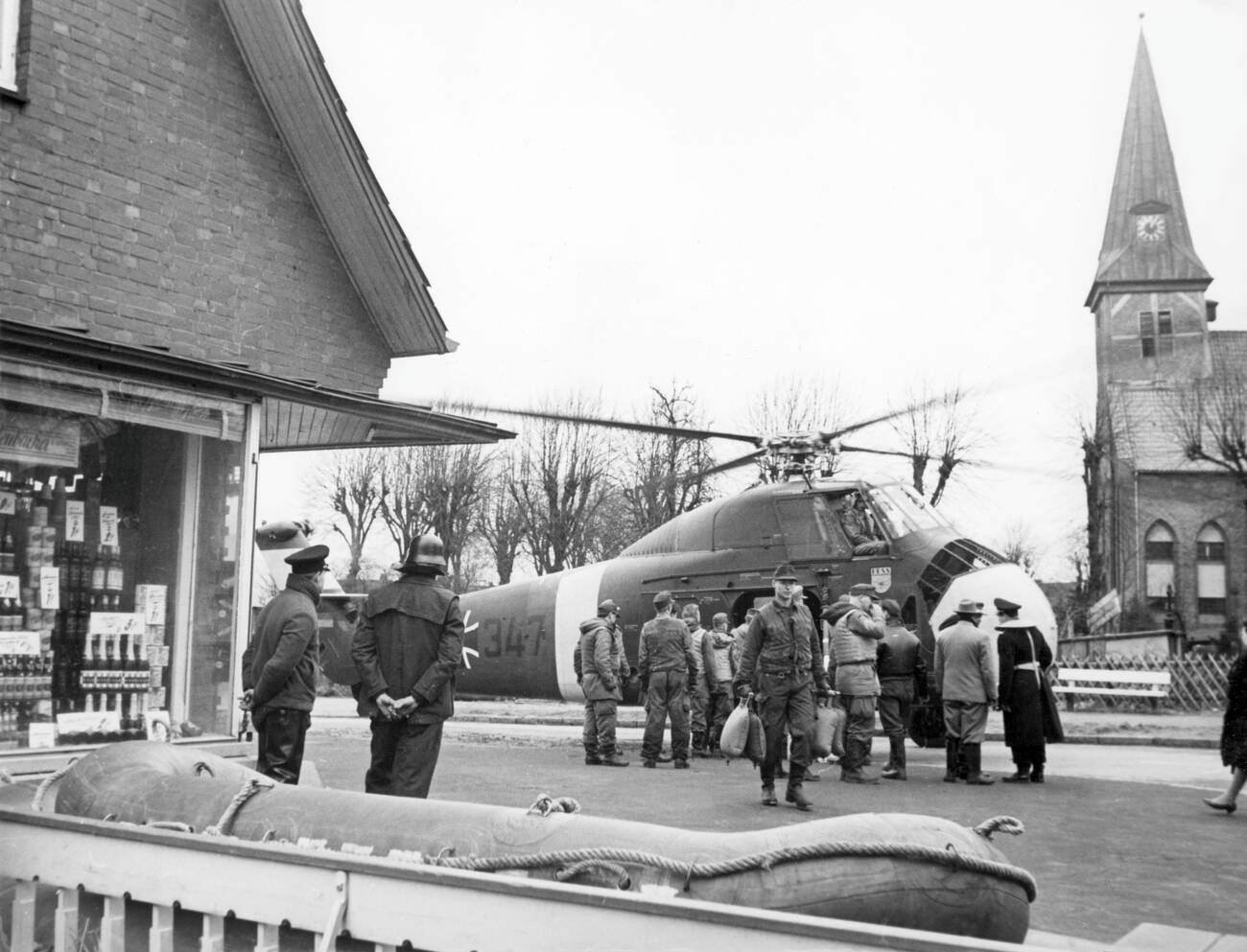 Unloading a helicopter during the North Sea Flood of 1962 in Hamburg, West Germany