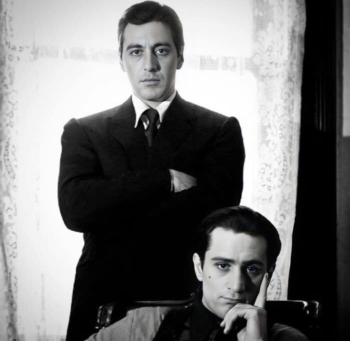 Al Pacino and Robert De Niro posing in a production still for The Godfather: Part II, 1974
