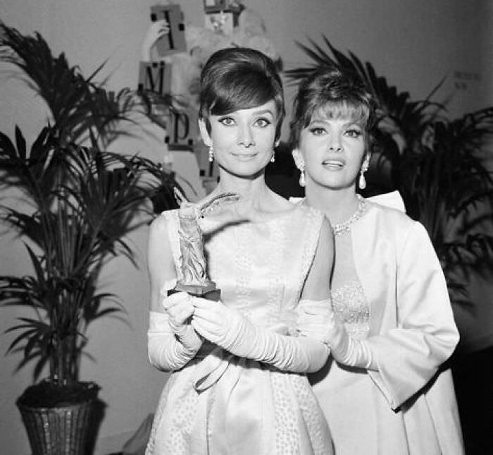 Audrey Hepburn and Gina Lollobrigida at the Marigny Theatre during the Nuit du Cinema in Paris, 1965