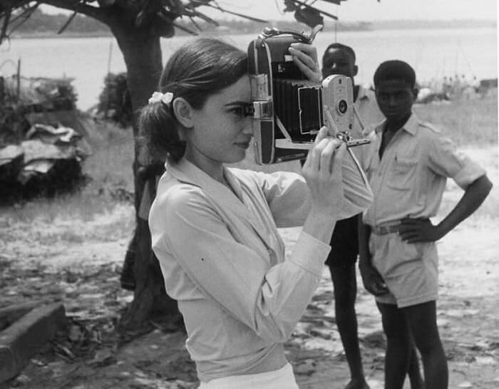 Audrey Hepburn taking pictures in Belgian Congo on the set of The Nun's Story, 1959