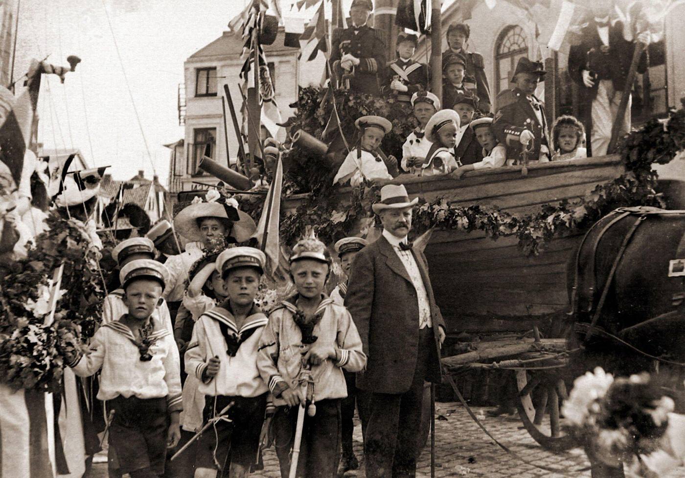 Festival procession with children as sailors in a ship in Hamburg, Germany, 1910