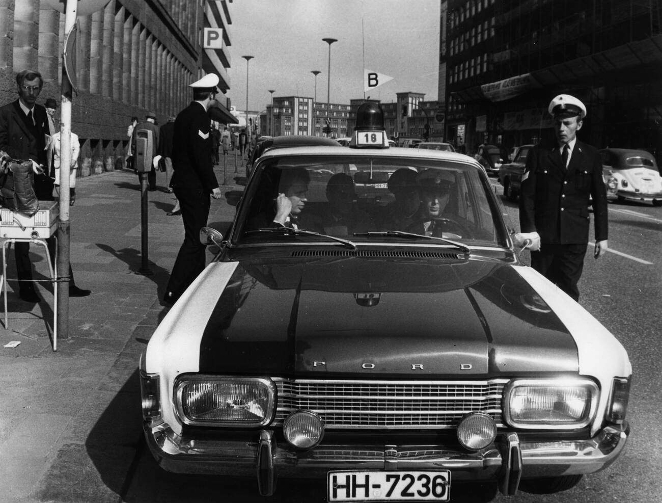 Police patrol car in front of the finance office in Hamburg, Germany after a robbery on April 21, 1971.