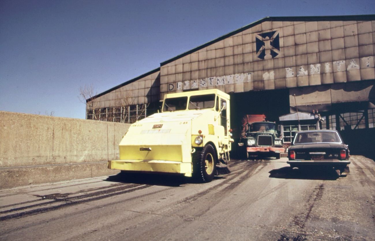 Garbage truck at the 91st street marine transfer station (mts). From the mts, waste is carried by barge down the east river to the landfill dump on staten island, 1970s