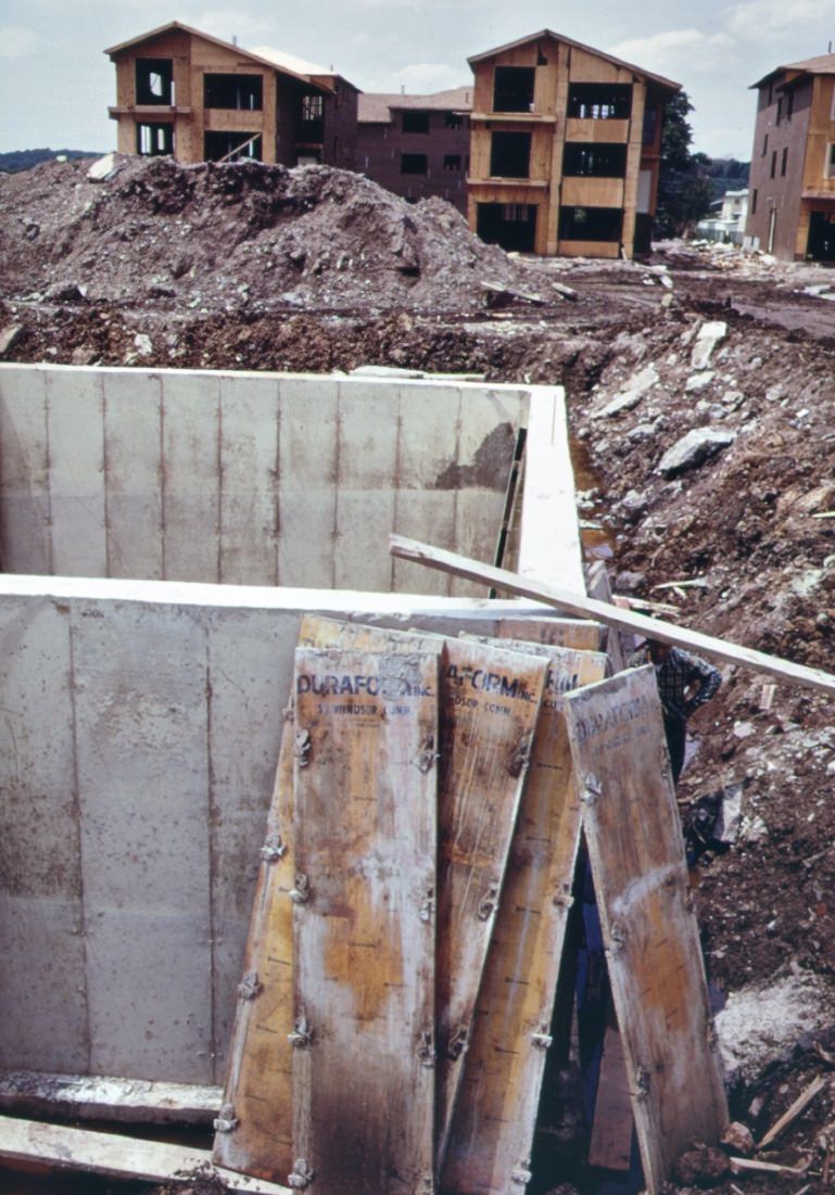 New homes under construction on staten island. Building boom here was touched off by completion of the verrazano-narrows bridge, making area easily accessible to brooklyn and lower manhattan, 1970s